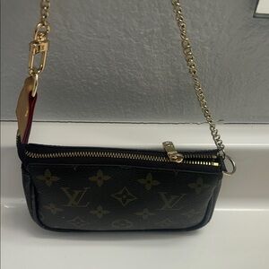 Louis Vuitton Black and Gold Monogram Clutch